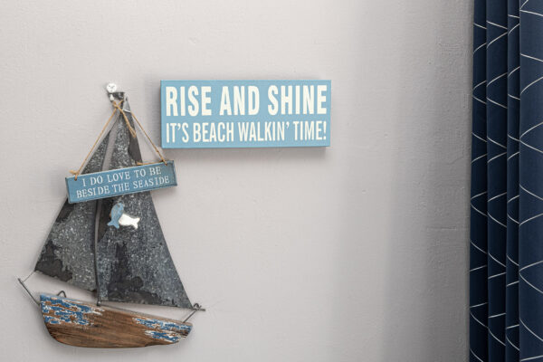 Wall decor with nautical theme: Rise and Shine sign, by UK property photographer in North Wales.