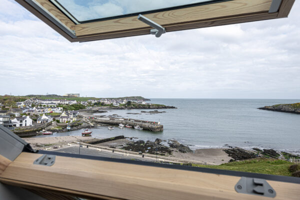 Coastal view from North Wales home, captured by UK property photographer, showcasing serene seaside landscape.