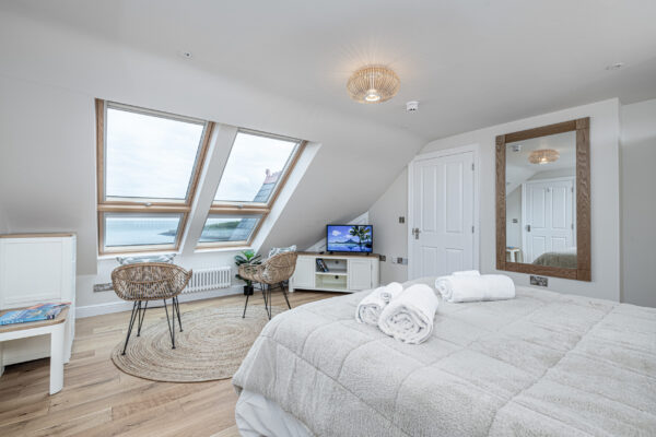 Cozy bedroom interior by UK property photographer, highlighting elegant decor in North Wales.