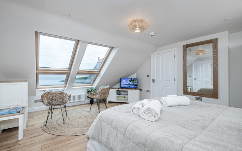 Cozy bedroom interior by UK property photographer, highlighting elegant decor in North Wales.