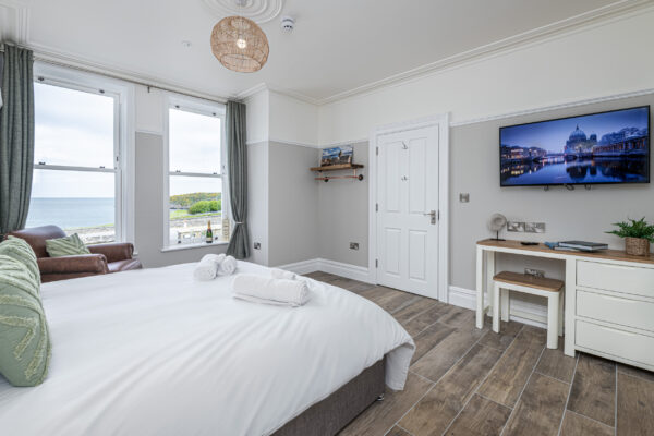 Coastal bedroom view by UK property photographer. Capturing elegance in North Wales.