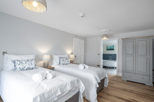 Modern bedroom captured by UK property photographer in North Wales, featuring stylish decor and natural light.
