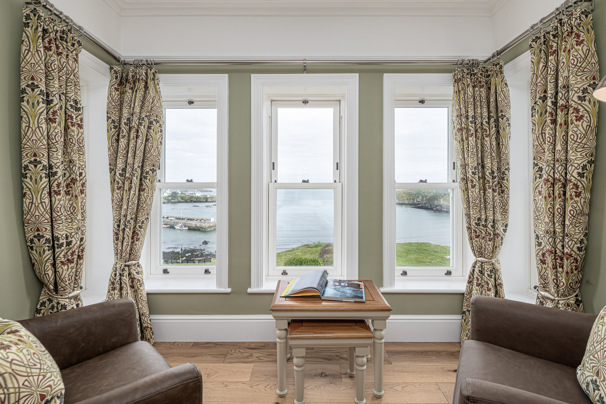 Scenic coastal view from a North Wales property, captured by UK property photographer through elegant windows.
