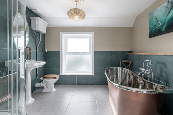 Luxurious bathroom captured by UK property photographer in North Wales. Elegant interior design showcase.