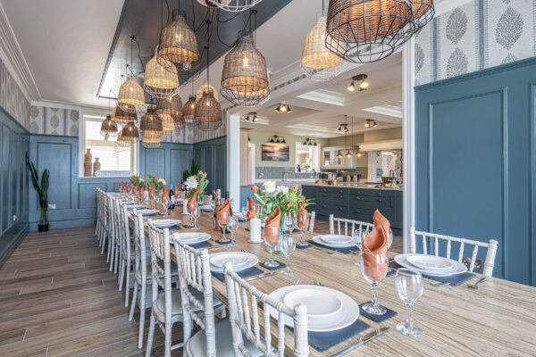Stylish dining area captured by a UK property photographer, North Wales. Elegant decor and modern lighting.