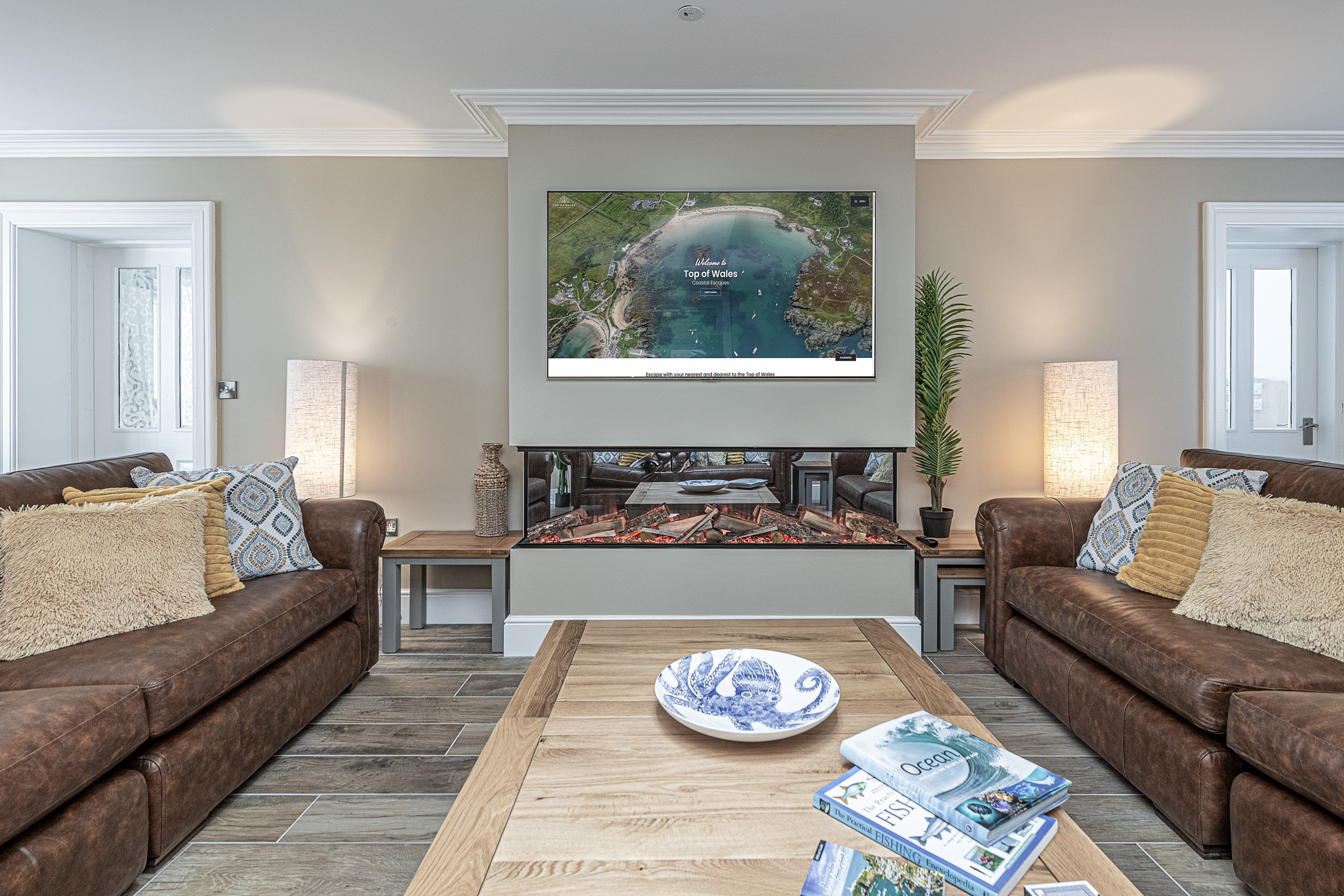 Elegant living room interior by UK property photographer, North Wales. Cozy seating and decor highlight the modern design.