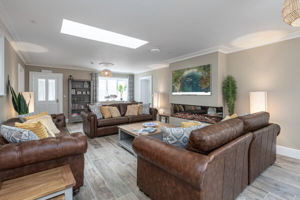 Luxury living room captured by a UK property photographer, featuring plush sofas and modern decor. North Wales photographer.