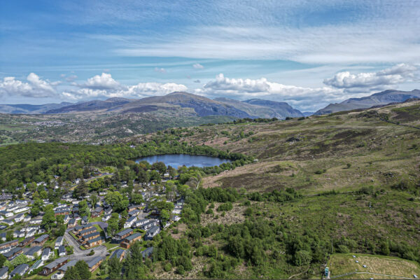 Aerial view of scenic North Wales landscape with lake, captured by UK property photographer.