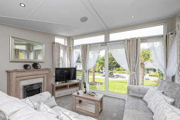 Stylish living room with garden view captured by UK property photographer, North Wales photographer.