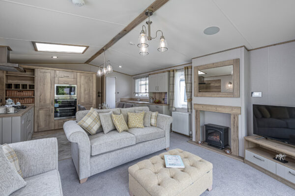 Modern living room photographed by UK property photographer in North Wales. Cozy design, fireplace, and stylish decor.