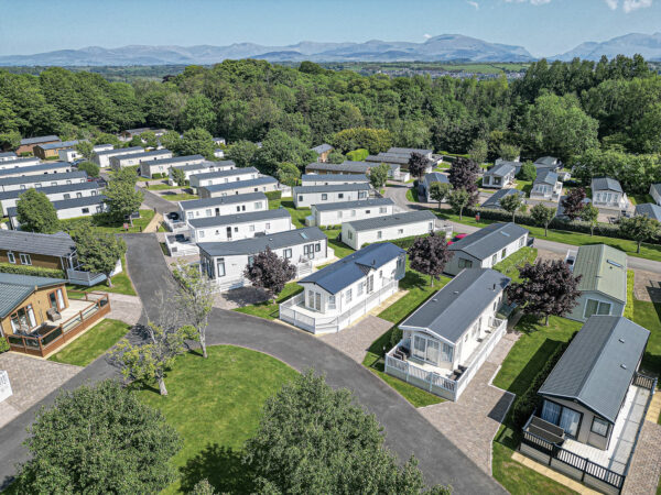 Aerial view of a property in North Wales by UK property photographer, showcasing modern holiday homes in lush surroundings.