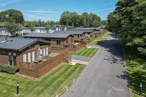 Aerial view of modern UK lodges, photographed by North Wales property photographer, showcasing green landscapes.