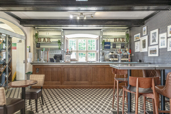 Chic bar interior captured by UK property photographer in North Wales. Stylish design and natural light.
