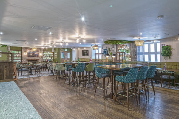 Modern UK bar interior captured by a North Wales property photographer showcasing elegant furniture and decor.
