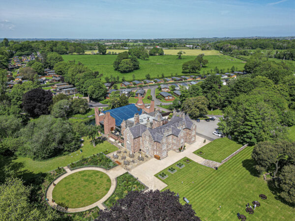 Aerial shot of a historic estate and lush gardens by a UK property photographer in North Wales.