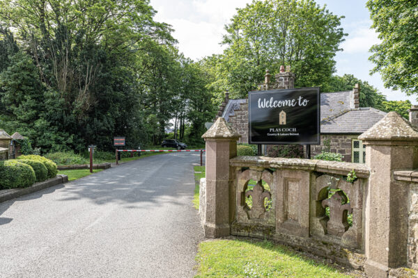 Scenic entrance to Plas Coch, captured by UK property photographer, North Wales photographer showcasing lush greenery.