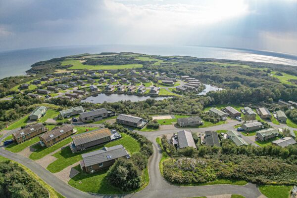 Aerial view of scenic North Wales property; captured by UK property photographer, showcasing coastal landscape.