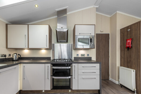 Modern kitchen interior captured by UK property photographer, North Wales. High-quality finishes and appliances.