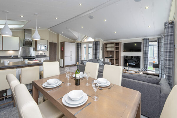 Luxury interior by UK property photographer, North Wales. Modern living space with elegant dining setup.