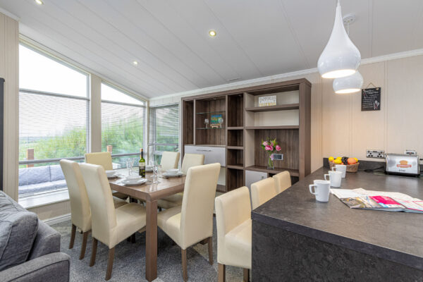 Modern dining and kitchen area captured by UK property photographer in North Wales.