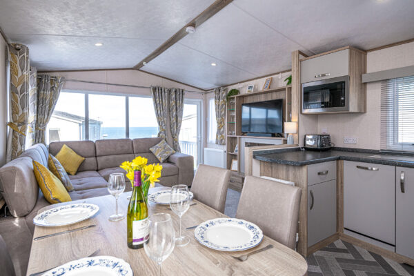 Interior shot of a modern UK property by North Wales photographer, showcasing a cozy living area with sea view.