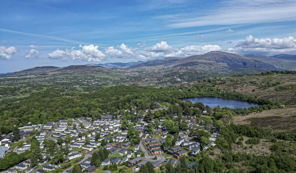 Aerial view of lush green landscape and homes in North Wales, captured by a UK property photographer.